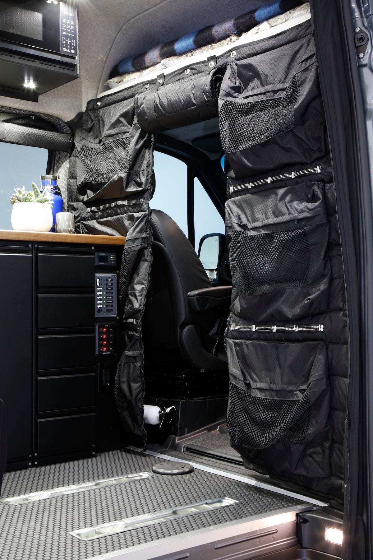 Smart Storage Solutions in Exclusive Outfitters Sprinter Vans